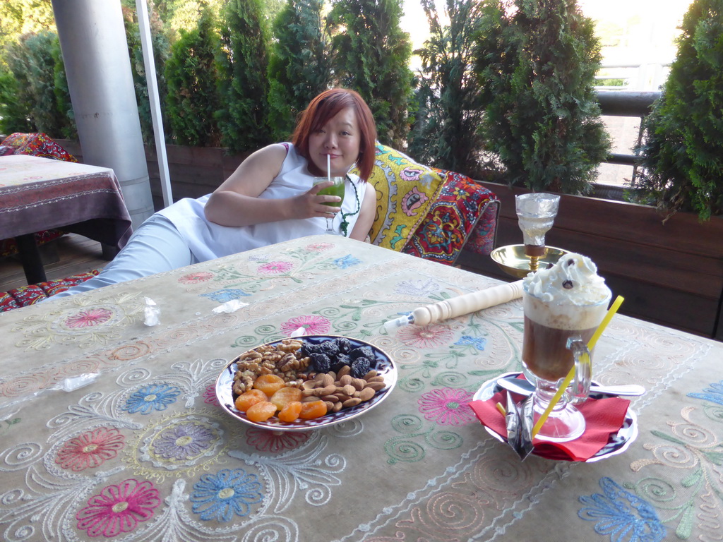 Miaomiao with cocktail, dried fruits, waterpipe and irish coffee at the Vostok Story restaurant at Yevropy Square