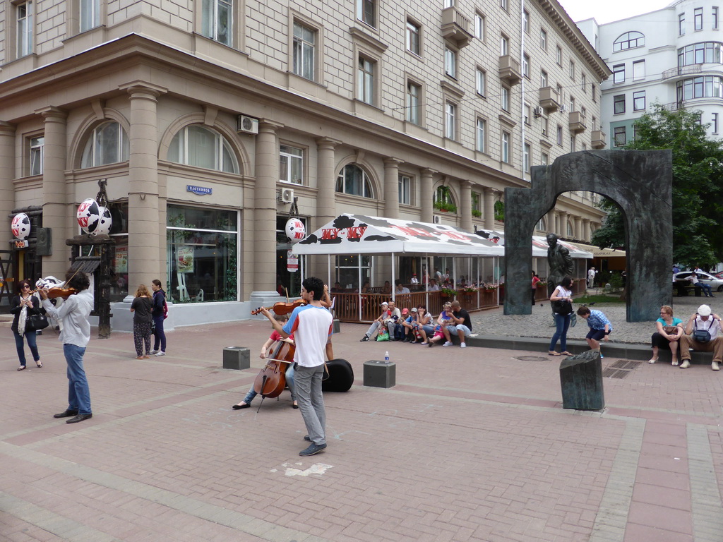 Street musicians in front of the Momument to Bulat Okudzhava at the crossing of Arbat street and Plotnikov lane