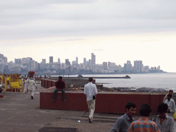 Tim and the skyline of Mumbai from a rock beach nearby
