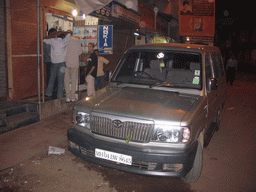 Rick, Chandan and our touring car at a mobile phone shop