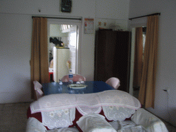 The living room and the kitchen in the apartment of Anand`s family
