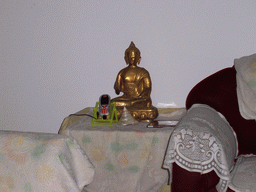 Buddhistic statue on the living room in the apartment of Anand`s family