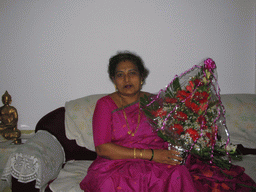 Anand`s mother with our flowers in the apartment of Anand`s family