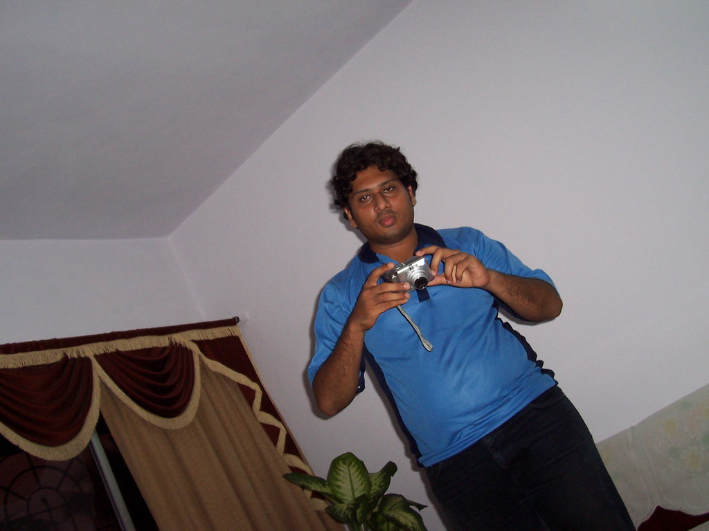 Swapnil with the photo camera in the apartment of Anand`s family