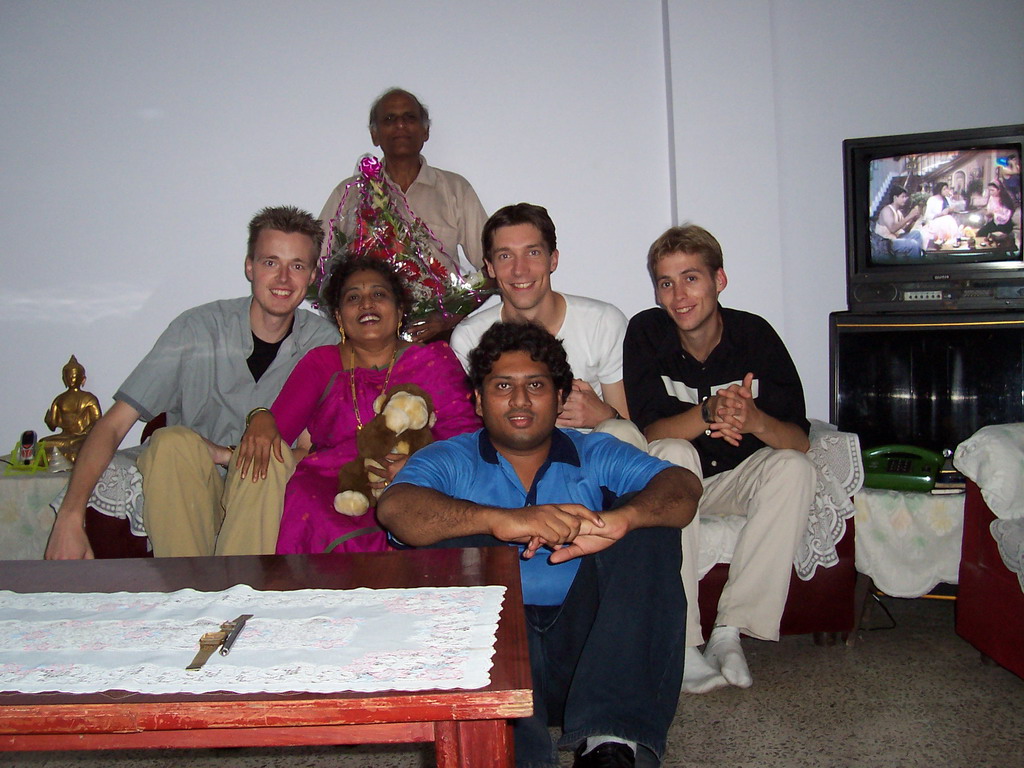 Tim, David, Rick, Swapnil and Anand`s parents with our flowers in the apartment of Anand`s family