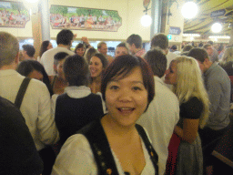 Miaomiao and people celebrating the Oktoberfest festival in the Paulaner tent at the Oktoberfest terrain at the Theresienwiese square