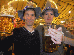Tim and a friend with beers, in the Paulaner tent at the Oktoberfest terrain at the Theresienwiese square