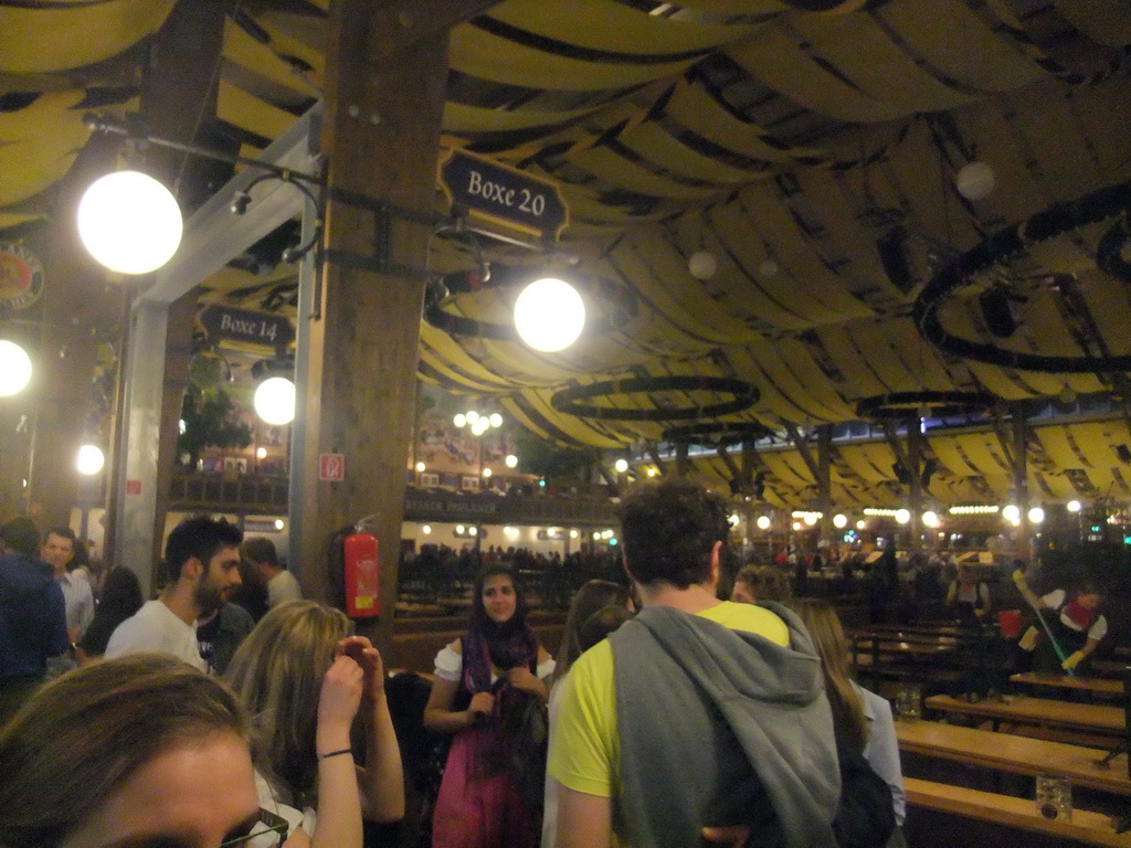 People celebrating the Oktoberfest festival in the Paulaner tent at the Oktoberfest terrain at the Theresienwiese square, during closing time