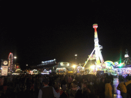 Funfair and the Nymphenburg Wein tent at the Oktoberfest terrain at the Theresienwiese square, by night