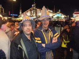 Friends in front of the Pschorr-Bräurosl tent at the Oktoberfest terrain at the Theresienwiese square, by night