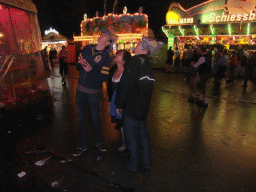 Miaomiao and friends at the funfair at the Oktoberfest terrain at the Theresienwiese square, by night