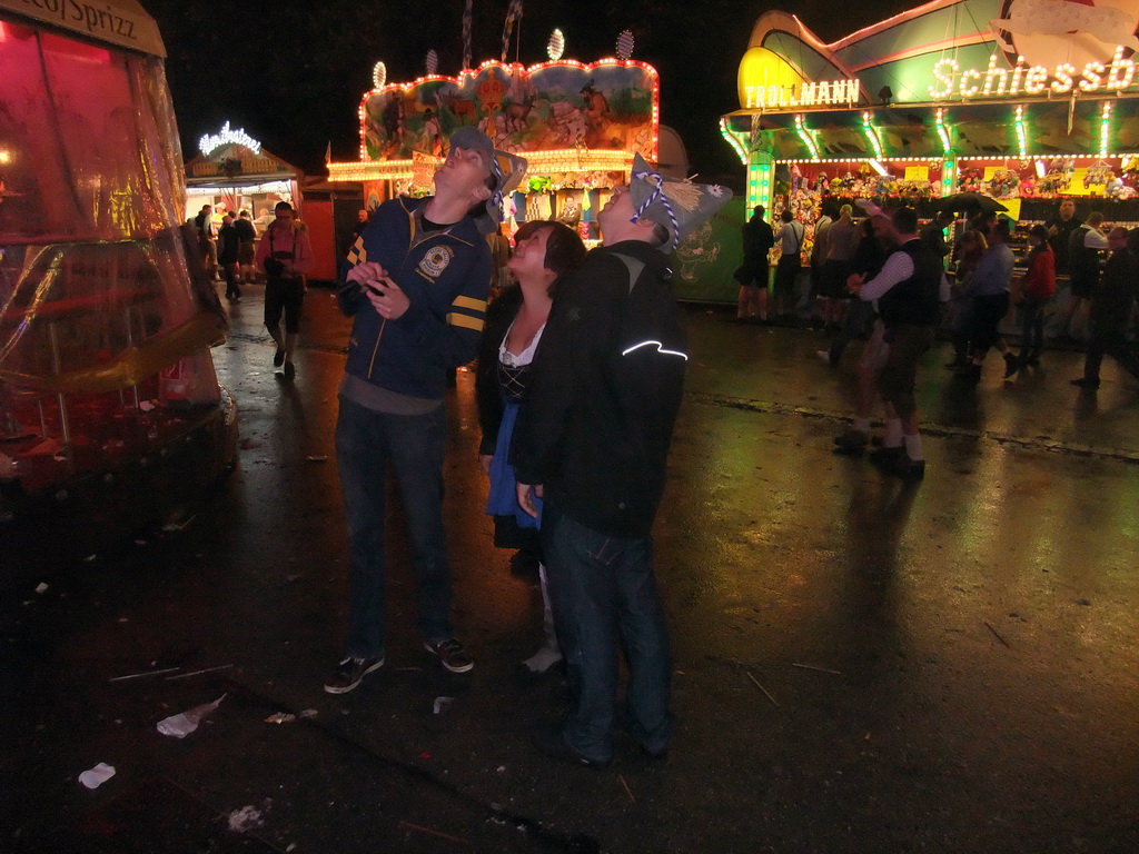 Miaomiao and friends at the funfair at the Oktoberfest terrain at the Theresienwiese square, by night