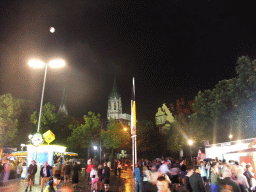 North side of the Oktoberfest terrain at the Theresienwiese square and St. Paul`s Church, by night