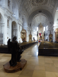 Nave and apse at St. Michael`s Church, with a statue of an angel