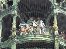 Figures at the upper part of the Rathaus-Glockenspiel chimes in the tower of the Neues Rathaus building, during the story of the marriage of the local Duke Wilhelm V to Renata of Lorraine