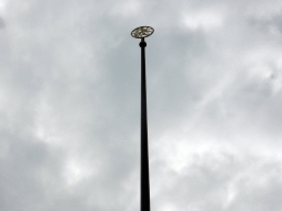 Top of a flagpole with a sign of a Bavarian lion, at the Odeonsplatz square