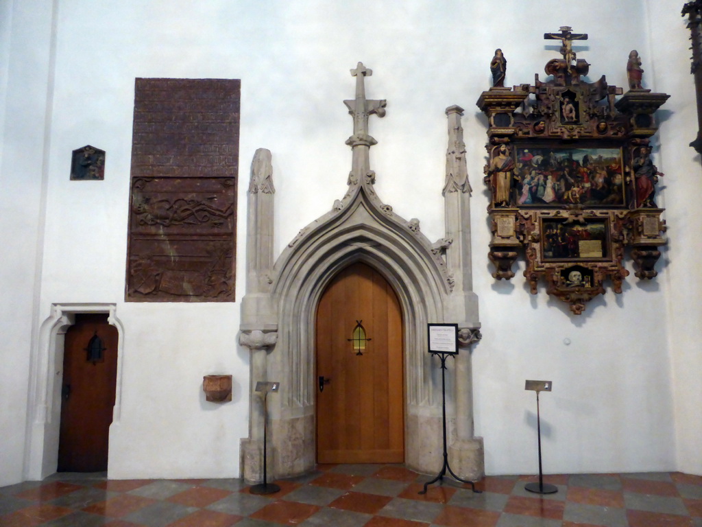 Relief, paintings and the door to the sacrament chapel, at the ambulatory of the Frauenkirche church
