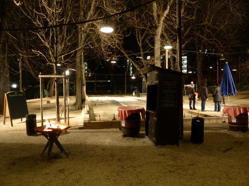 Beer garden and ice stock sport (Bavarian Curling) track of the Augustiner Keller beer hall, by night