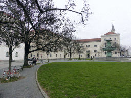 Fountain at the Professor-Huber-Platz square, and the east part of the Ludwig Maximilian University of Munich