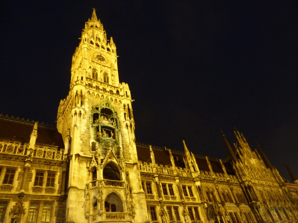 Right front and tower of the Neues Rathaus building, viewed from the Marienplatz square, by night