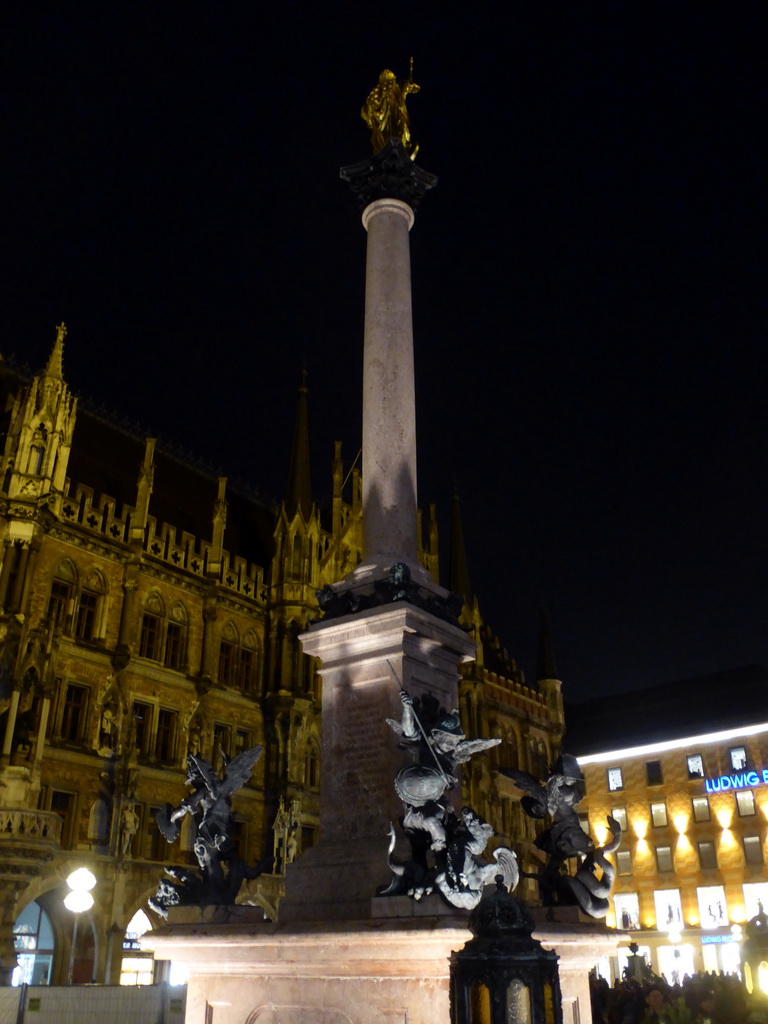 Mariensäule column and right front of the Neues Rathaus building, viewed from the Marienplatz square, by night