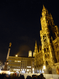 The Marienplatz square with the Mariensäule column, the towers of the Frauenkirhce church and the tower and left front of the the Neues Rathaus building, by night