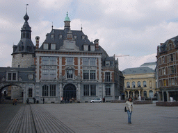 Miaomiao at the Place d`Armes square with the Belfry of Namur and the Namur Palais des Congrès building