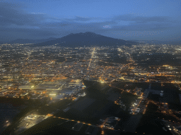 The east side of the city and Mount Vesuvius, viewed from the airplane from Eindhoven, at sunset