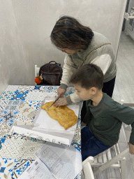 Miaomiao and Max with a Pizza Fritta at the dinner table in the kitchen of the House of Mola apartment