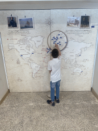 Max with a map with the voyages of Charles Darwin and the marine stations of Anton Dohrn at the Museo Darwin Dohrn museum