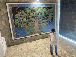 Max with a painting of the Tree of Life at the Museo Darwin Dohrn museum