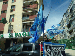 Flags for SSC Napoli`s third Italian championship at the Via Giacomo Leopardi street, viewed from the rental car