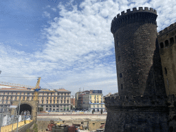 Northwest side and moat of the Castel Nuovo castle and the Piazza Municipio square, viewed from the access bridge