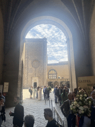 Wedding guests at the entrance gate to the Castel Nuovo castle