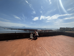 Tim and Max at the Pedro de Toledo Loggia at the Third Floor of the Civic Museum at the Castel Nuovo castle, with a view on the Naples Port with the Pier with the Molo San Vincenzo Lighthouse