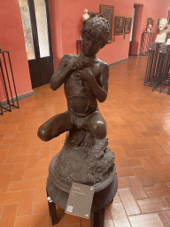 Statue `Giovane Pescatore Napoletano` by Vincenzo Gemito at the Third Floor of the Civic Museum at the Castel Nuovo castle, with explanation