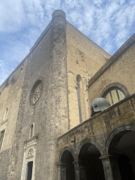 Front of the Palatine Chapel and a helmet statue at the Castel Nuovo castle, viewed from the inner square