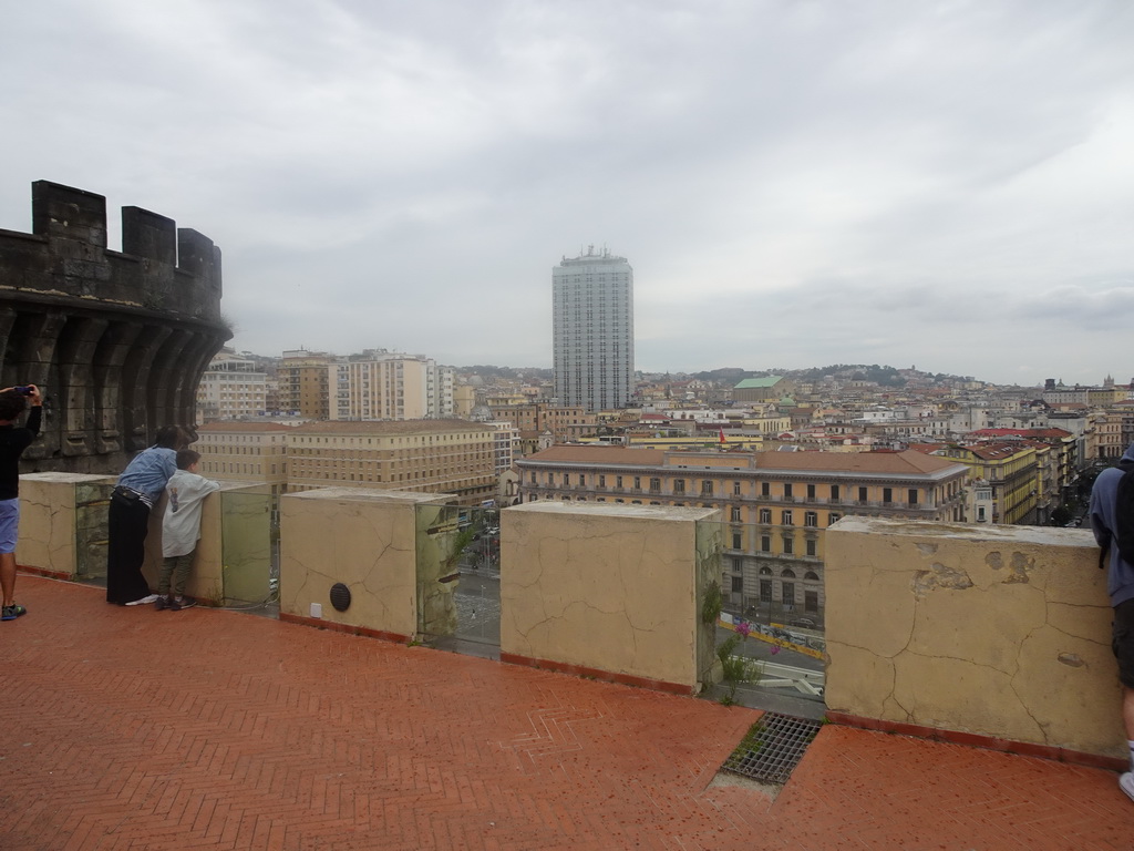 Miaomiao and Max at the north side of the roof of the Castel Nuovo castle with the Tower of San Giorgio, with a view on the city center with the Hotel NH Napoli Panorama and the Museo Di Santa Chiara museum