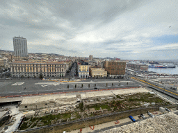 Ruins at the Piazza Municipio square, the Naples Port and the city center with the Hotel NH Napoli Panorama, viewed from the north side of the roof of the Castel Nuovo castle