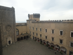 Inner square of the Castel Nuovo castle with the Gold Tower and the front of the Palatine Chapel and the Civic Museum, viewed from the northwest side of the roof