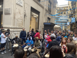 Street musicians and decorations for SSC Napoli`s third Italian championship at the crossing of the Via Toledo street and the Piazzetta Matilde Serao square
