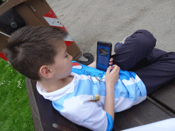 Max playing a flags game on the iPhone at the Zoo di Napoli