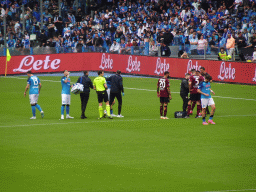 SSC Napoli player being treated at the Stadio Diego Armando Maradona stadium, viewed from the Curva A Inferiore grandstand, during the football match SSC Napoli - Salernitana