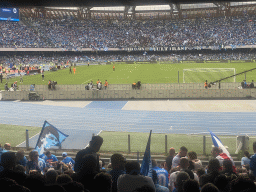 Substitute players on the pitch at the Stadio Diego Armando Maradona stadium, viewed from the Curva A Inferiore grandstand, during halftime at the football match SSC Napoli - Salernitana