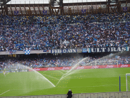 Sprinklers on the pitch at the Stadio Diego Armando Maradona stadium, viewed from the Curva A Inferiore grandstand, during halftime at the football match SSC Napoli - Salernitana