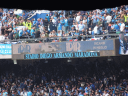 Football fans and stadium name at the Distinti grandstand at the Stadio Diego Armando Maradona stadium, during halftime at the football match SSC Napoli - Salernitana