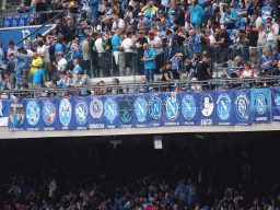 Football fans and fan club logos at the Distinti grandstand at the Stadio Diego Armando Maradona stadium, during halftime at the football match SSC Napoli - Salernitana