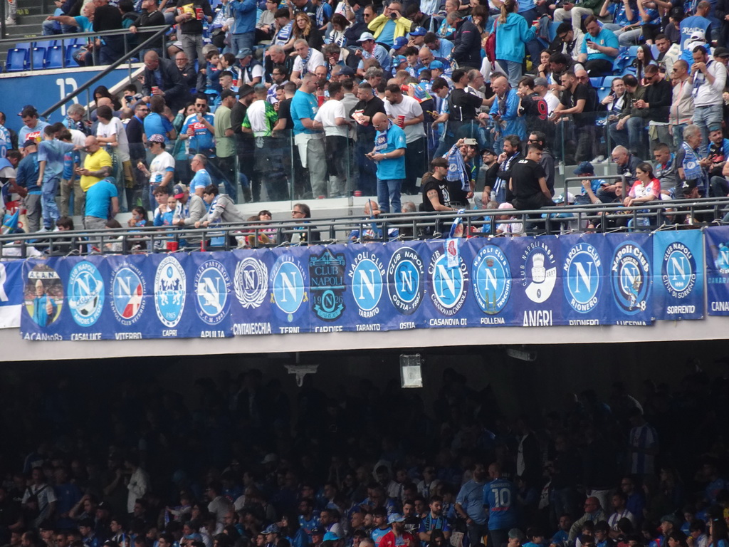 Football fans and fan club logos at the Distinti grandstand at the Stadio Diego Armando Maradona stadium, during halftime at the football match SSC Napoli - Salernitana