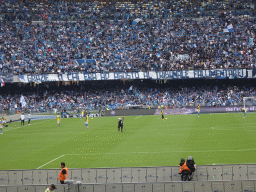 Substitute players on the pitch at the Stadio Diego Armando Maradona stadium, viewed from the Curva A Inferiore grandstand, during halftime at the football match SSC Napoli - Salernitana