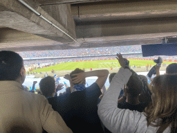 Players on the pitch and football fans at the Curva B grandstand celebrating a SSC Napoli goal at the Stadio Diego Armando Maradona stadium, during the football match SSC Napoli - Salernitana